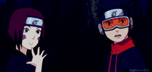 a boy and a girl are standing next to each other with a g on their headbands