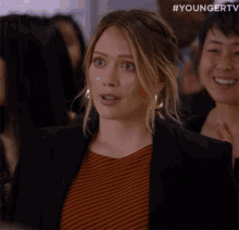 a close up of a woman 's face with #youngertv written on the bottom right
