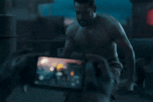 a shirtless man is standing in front of a building with the hashtag 7wickreddy
