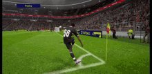 a soccer player with the number 66 on his jersey is kicking a ball