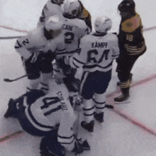 a group of hockey players including one with the number 64 on his back