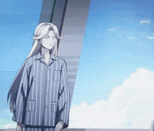 a woman with long white hair wearing a striped pajama shirt