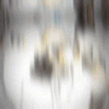 a blurred image of a person walking on a sidewalk