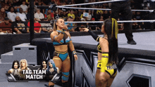 two women in a wrestling ring with the words tag team match on the screen