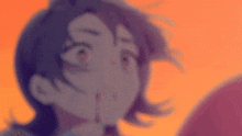 a blurry picture of a girl 's face with a purple background .