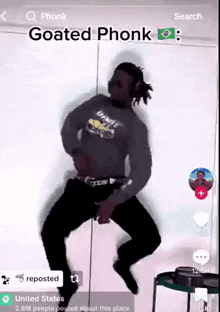 a man is dancing in front of a mirror with the caption goated phonk .