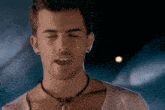 a man with his eyes closed and his tongue sticking out