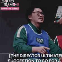 behind the scenes of squid game 3 shows a man wearing number 007