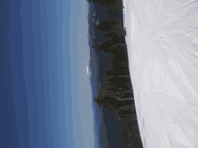 a ski slope with a mountain in the background