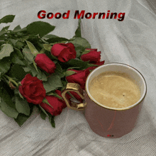 a bouquet of red roses next to a cup of coffee with the words good morning written on it