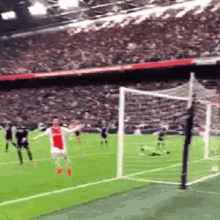 a soccer game is being played in a stadium