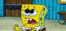 a cartoon character named spongebob is sitting on the floor and crying .