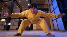 Sammo Hung Yellow Jumpsuit GIF - Sammo Hung Yellow Jumpsuit Kung Fu GIFs