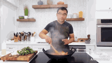 a man is cooking in a kitchen with the words made in animatica on the bottom right