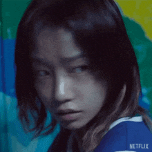 a close up of a woman 's face with netflix written on the bottom right