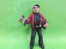 a clay figure of a man in a red jacket holding a smaller man