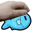 a person is petting a blue cartoon fish with a surprised face .