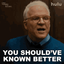 a man wearing glasses and a blue shirt says you should 've known better