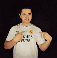 a man wearing a shirt that says " emirates better "