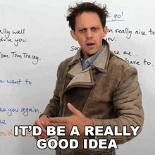 a man giving a thumbs up in front of a white board with the words it 'd be a really good idea