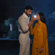 a man and a woman standing next to each other