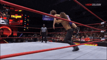 a wrestling match is being broadcasted on a new collision network