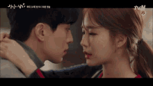 a close up of a man and woman kissing with the tvn logo in the corner