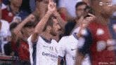 a soccer player wearing a shirt that says betsson