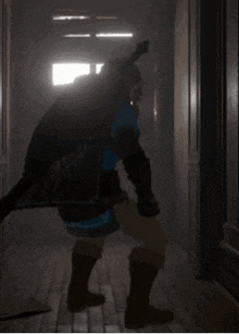 a person standing in a hallway with a sword in their hand