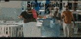 a group of men are walking in a room with the words starttamilchat.nl written on the bottom