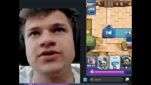 a man wearing headphones looks at a screen with a game in progress