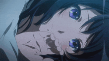 a girl with purple eyes is laying down and covering her mouth with her hand