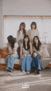 a group of girls sitting on a couch with emily party written on the bottom right