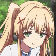 a blonde anime girl with green eyes has a red x on her hair
