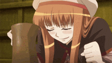 a girl with long brown hair is holding a cup with the letter o on it
