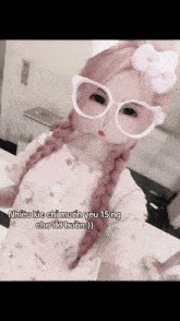 a girl with pink hair is wearing glasses and a hello kitty outfit