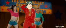 a group of people are dancing in front of a sign that says the great valley senior high