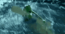 a person is riding a wave on a surfboard in the ocean .