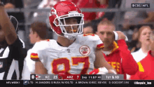 a football player wearing a helmet with the number 7 on it