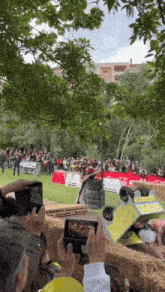 a group of people are taking pictures of a race in a field