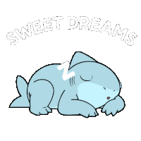 a shark laying down with the words sweet dreams written above it