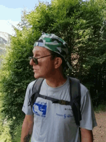 a man wearing a white shirt that says columbia