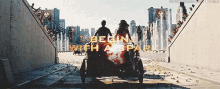 a man and a woman are riding a motorcycle with the words begin with a spark written on it