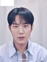 a close up of a young man wearing headphones .