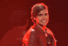 a blurry picture of a man in a red jacket