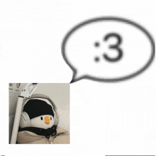 a picture of a stuffed animal with headphones and a speech bubble with the number 3