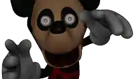 a close up of a mickey mouse 's face and hands