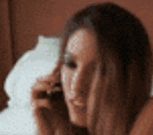 a blurry picture of a woman talking on her phone