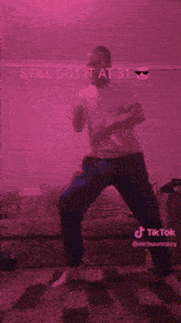 a man is dancing in front of a couch with the words still got it at 31 behind him