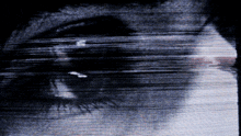 a blurry picture of a person 's eye with a few lines visible